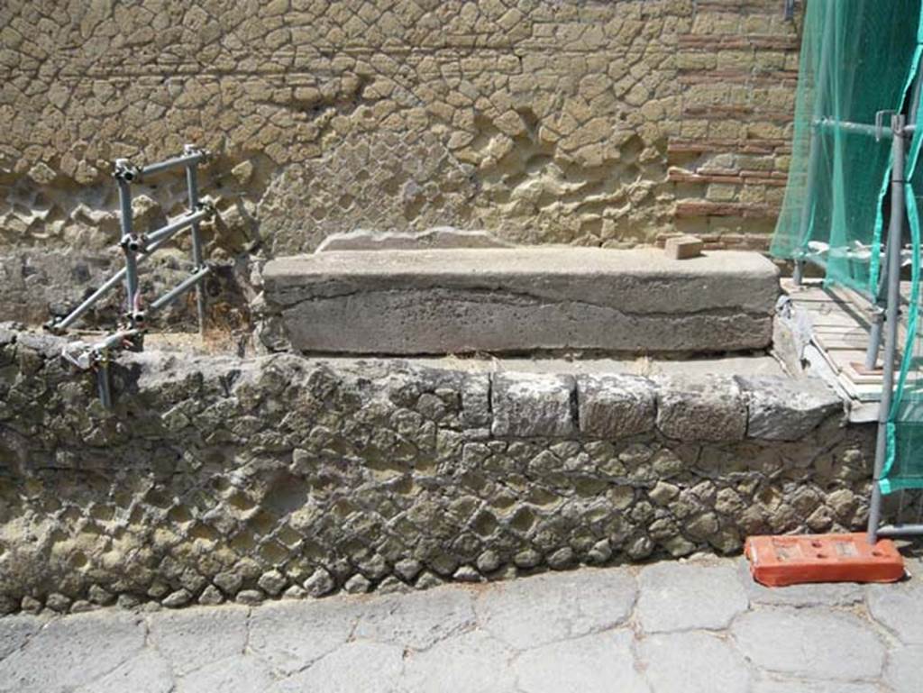 IV.21, Herculaneum, August 2013. Bench on south side of entrance doorway. Photo courtesy of Buzz Ferebee.